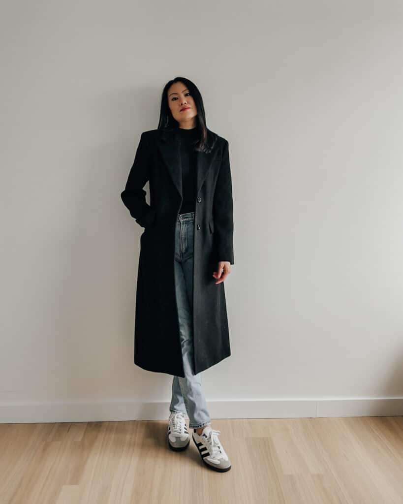 Winter Outfit Idea. Elaine Le wears long wool tailored coat by Mango, Straight leg jeans by Abercrombie, mock neck top and Adidas Samba OG sneakers.