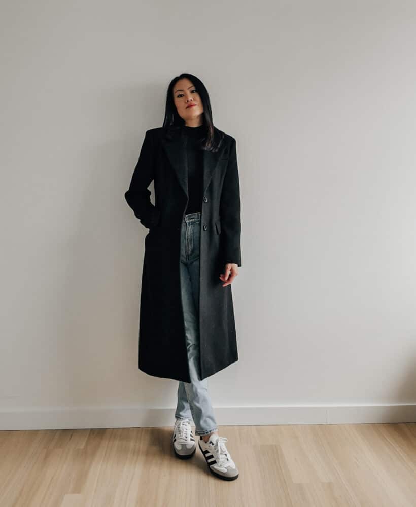 Elaine Le wears wool structured coat by Mango, Aritzia mockneck top, straight leg jeans from Abercrombie and Adidas Sambas OG.